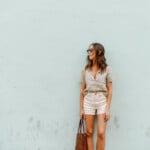 Camille Styles wearing white denim shorts.